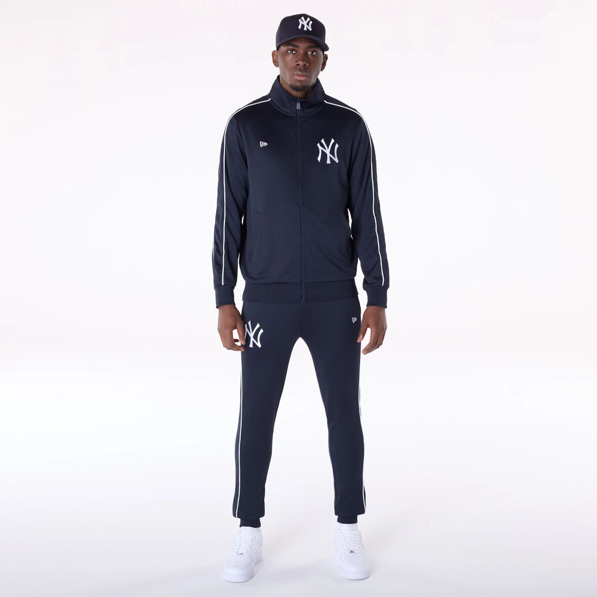 The Male model is wearing New York Yankees MLB Track Pants Navy Fleece Joggers 8