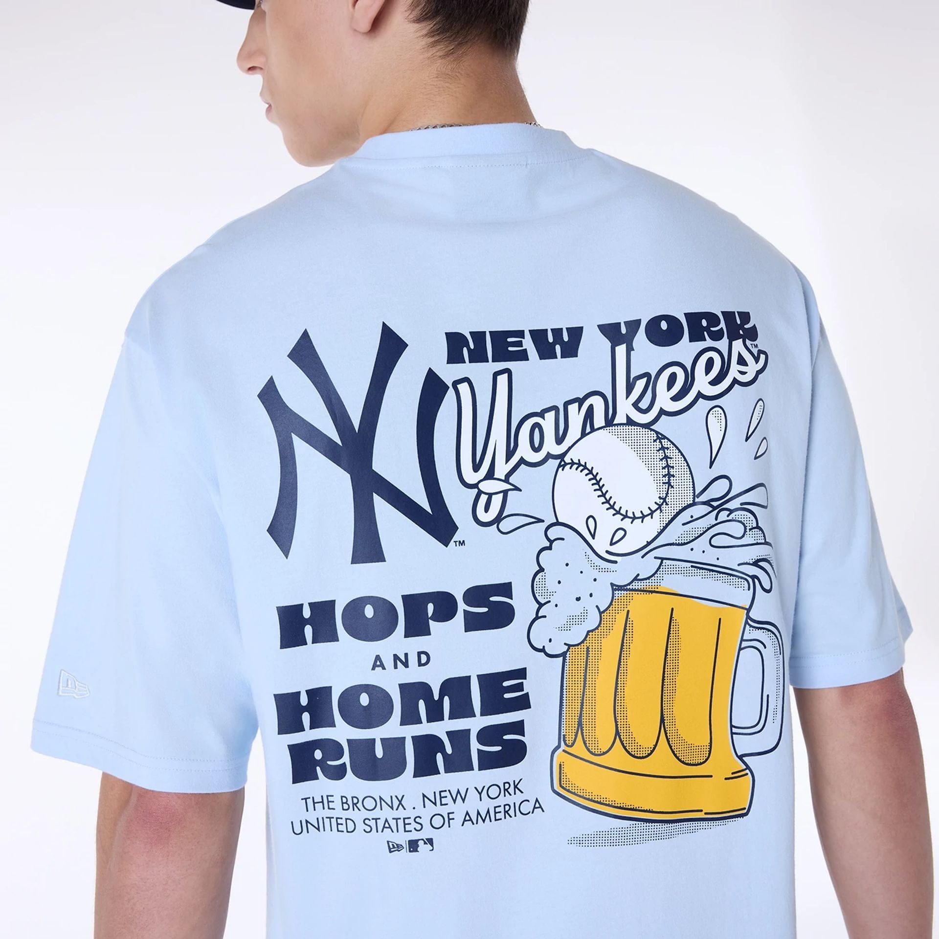 The Male model is wearing New York Yankees MLB Food Graphic Pastel Blue Oversized T-Shirt 4