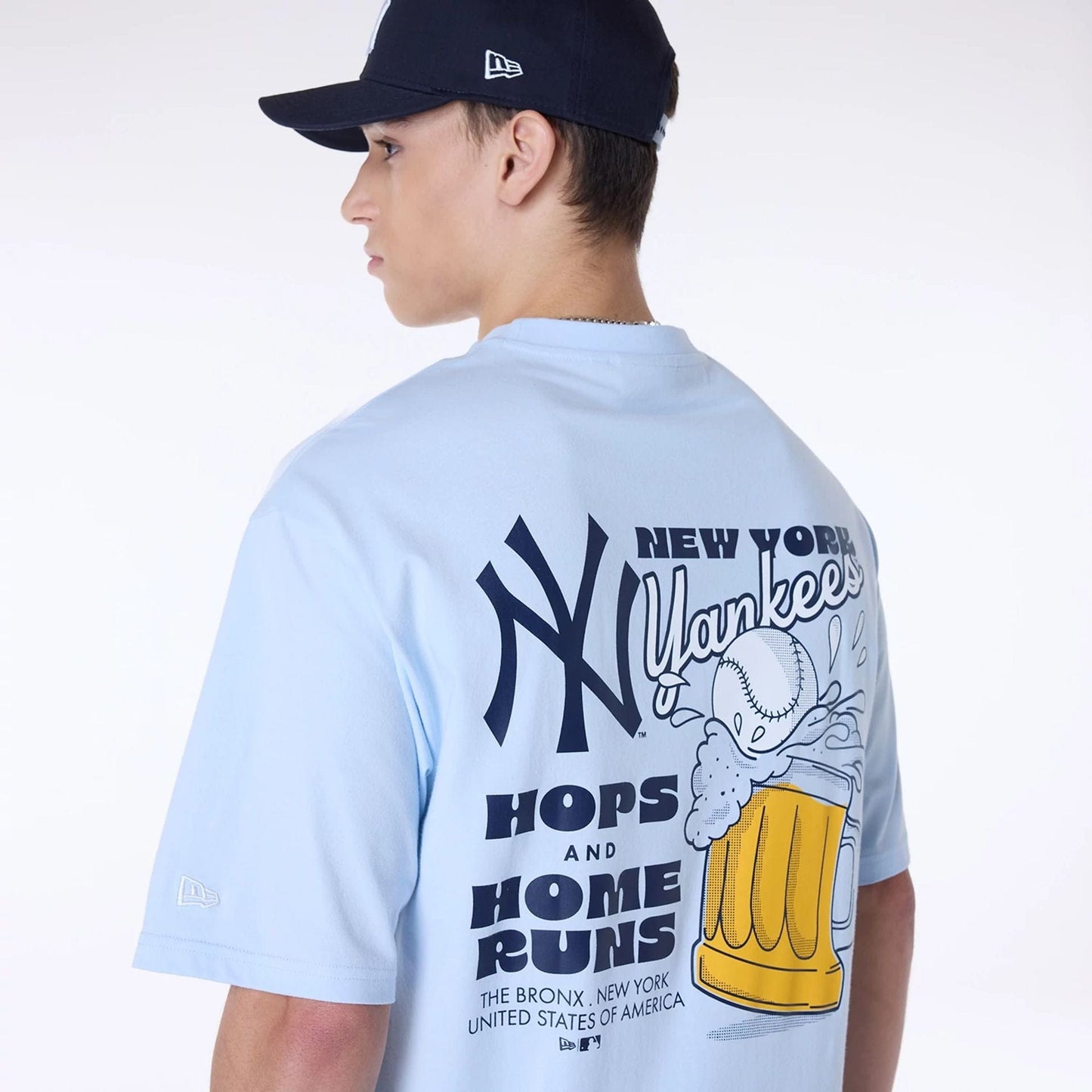 The Male model is wearing New York Yankees MLB Food Graphic Pastel Blue Oversized T-Shirt 5