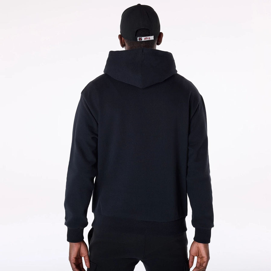 The Male model is wearing Chicago Bulls NBA Graphic Black Oversized Pullover Hoodie 2