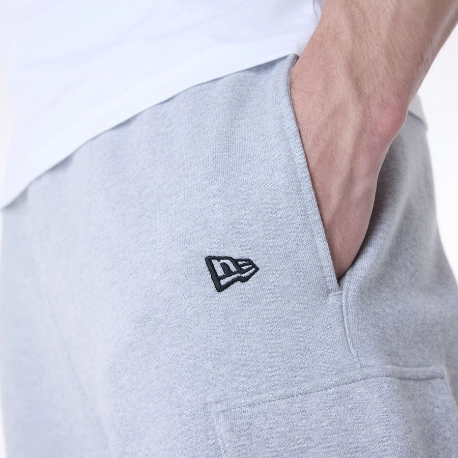 The Male model is wearing New Era Script Grey Fleece Joggers 7