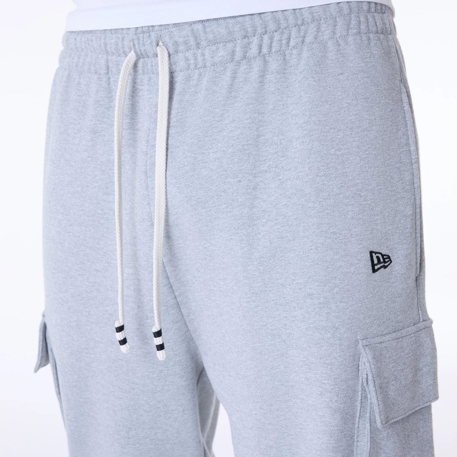 The Male model is wearing New Era Script Grey Fleece Joggers 5