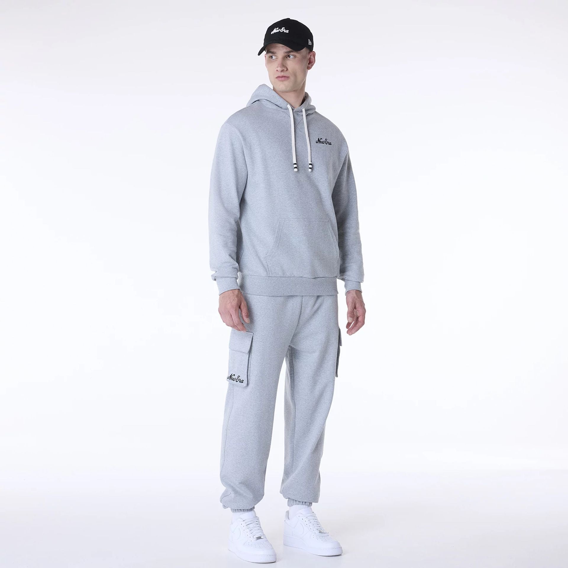 The Male model is wearing New Era Script Grey Fleece Joggers 6
