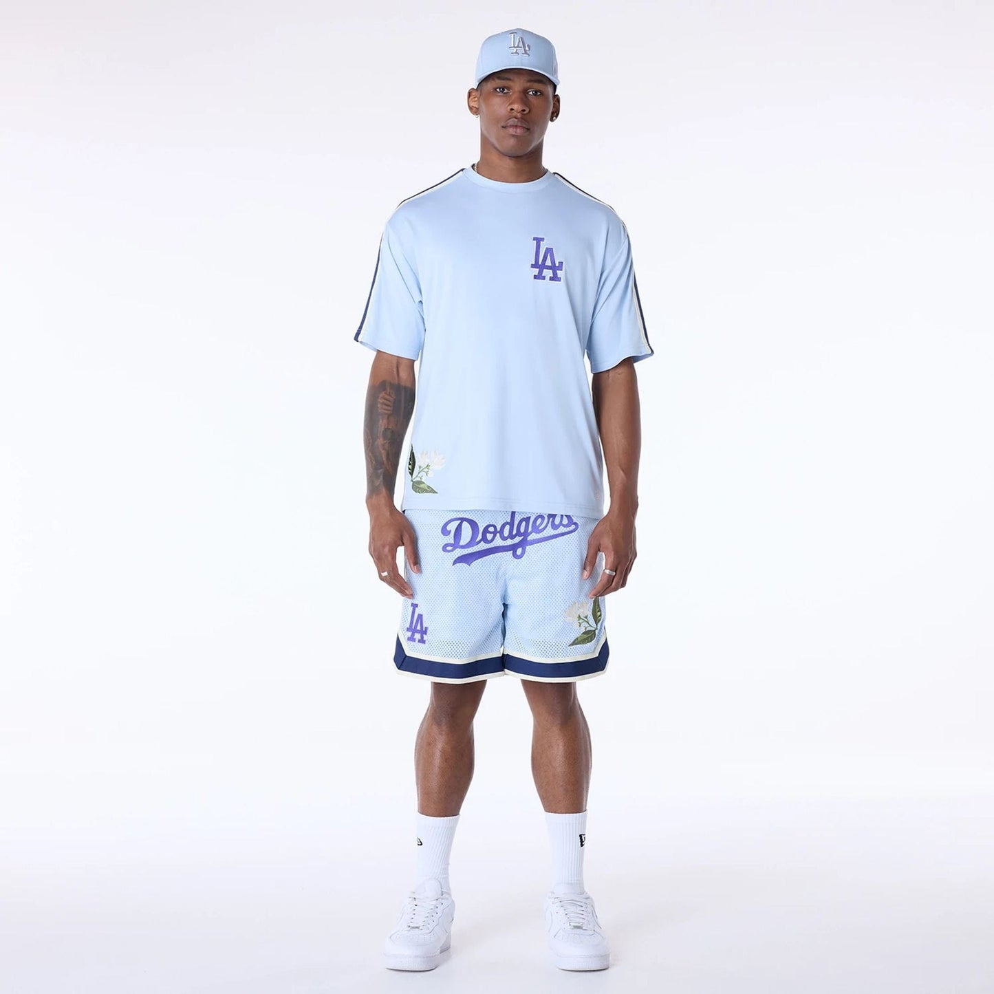 The Male model is wearing LA Dodgers MLB Floral Pastel Blue Oversized T-Shirt 4