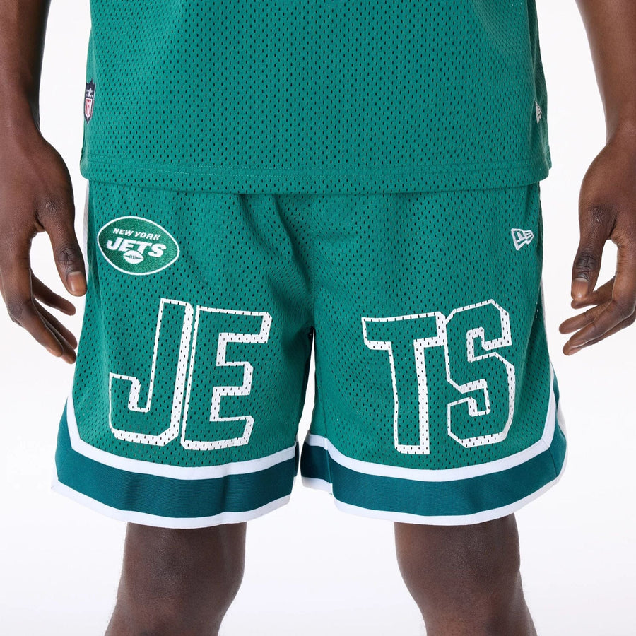 The Male model is wearing New York Jets NFL Mesh Green Shorts 8