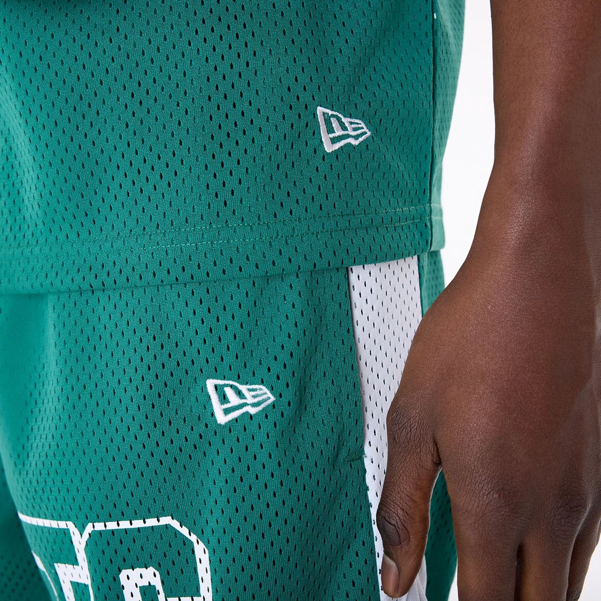 The Male model is wearing New York Jets NFL Mesh Green Shorts 5