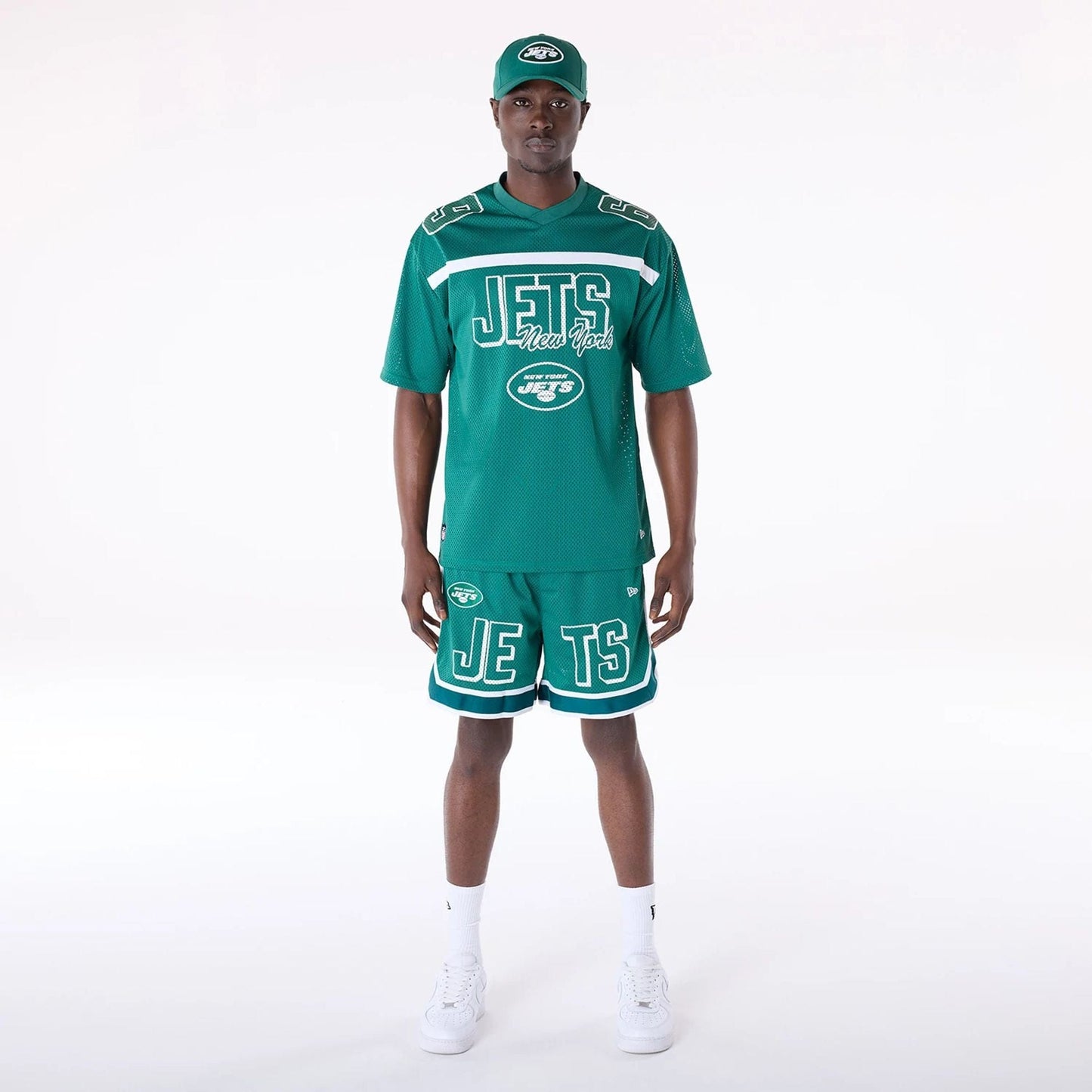 The Male model is wearing New York Jets NFL Mesh Green Shorts 4