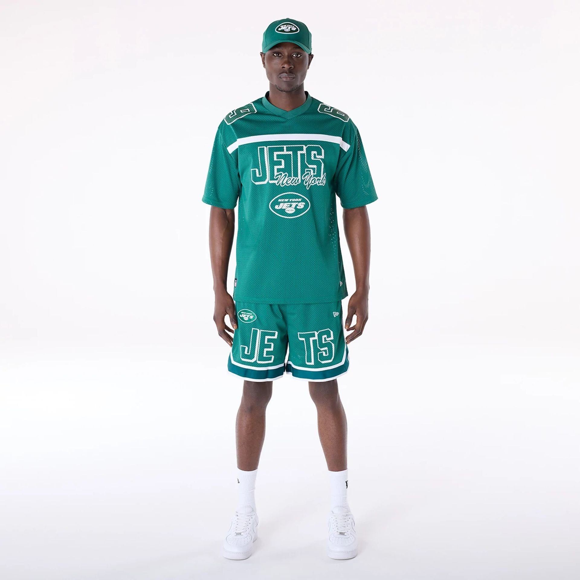 The Male model is wearing New York Jets NFL Mesh Green Shorts 4