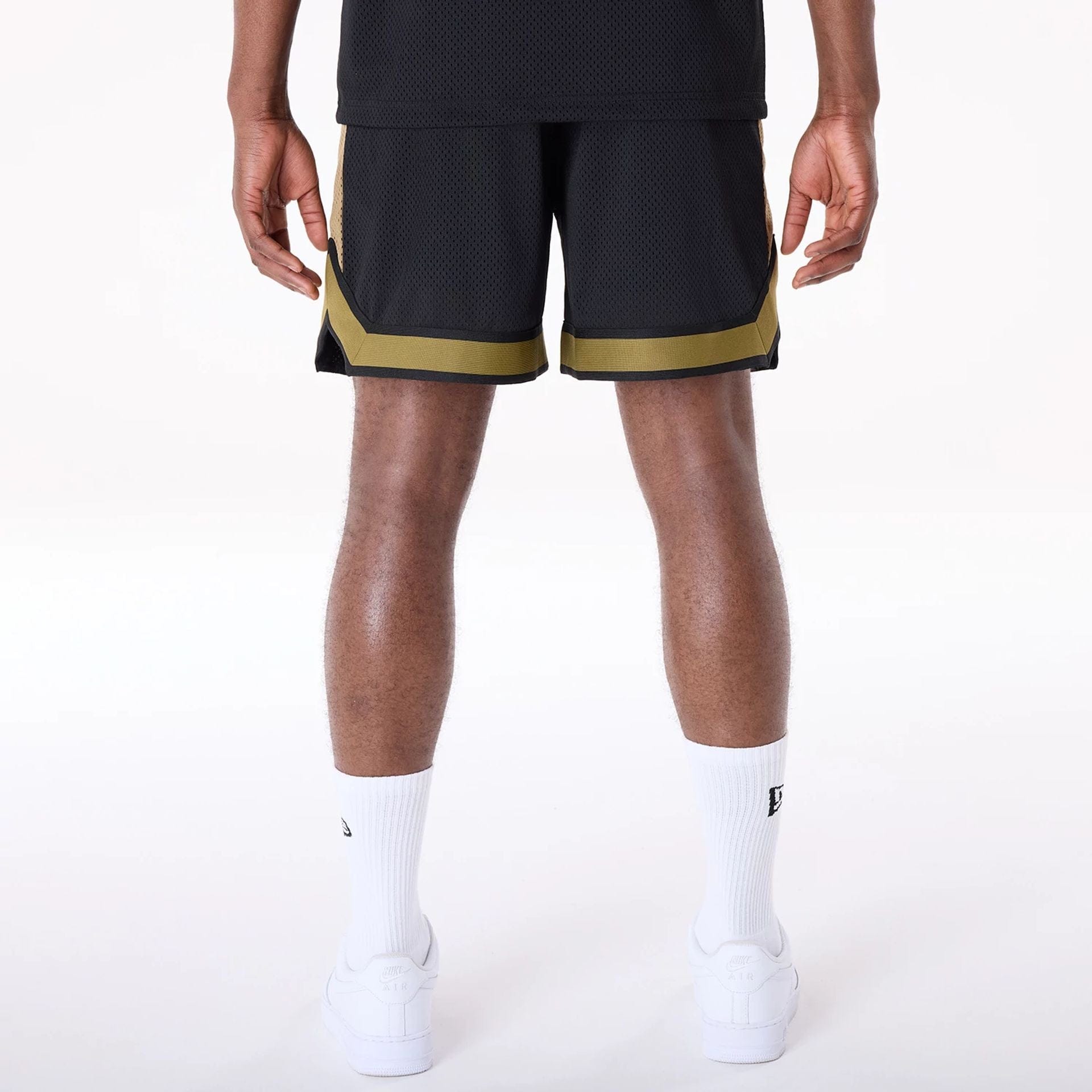 The Male model is wearing San Francisco 49ers NFL Mesh Black Shorts 2