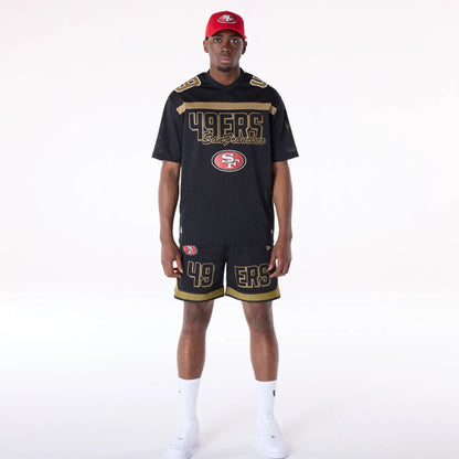 The Male model is wearing San Francisco 49ers NFL Mesh Black Shorts 8