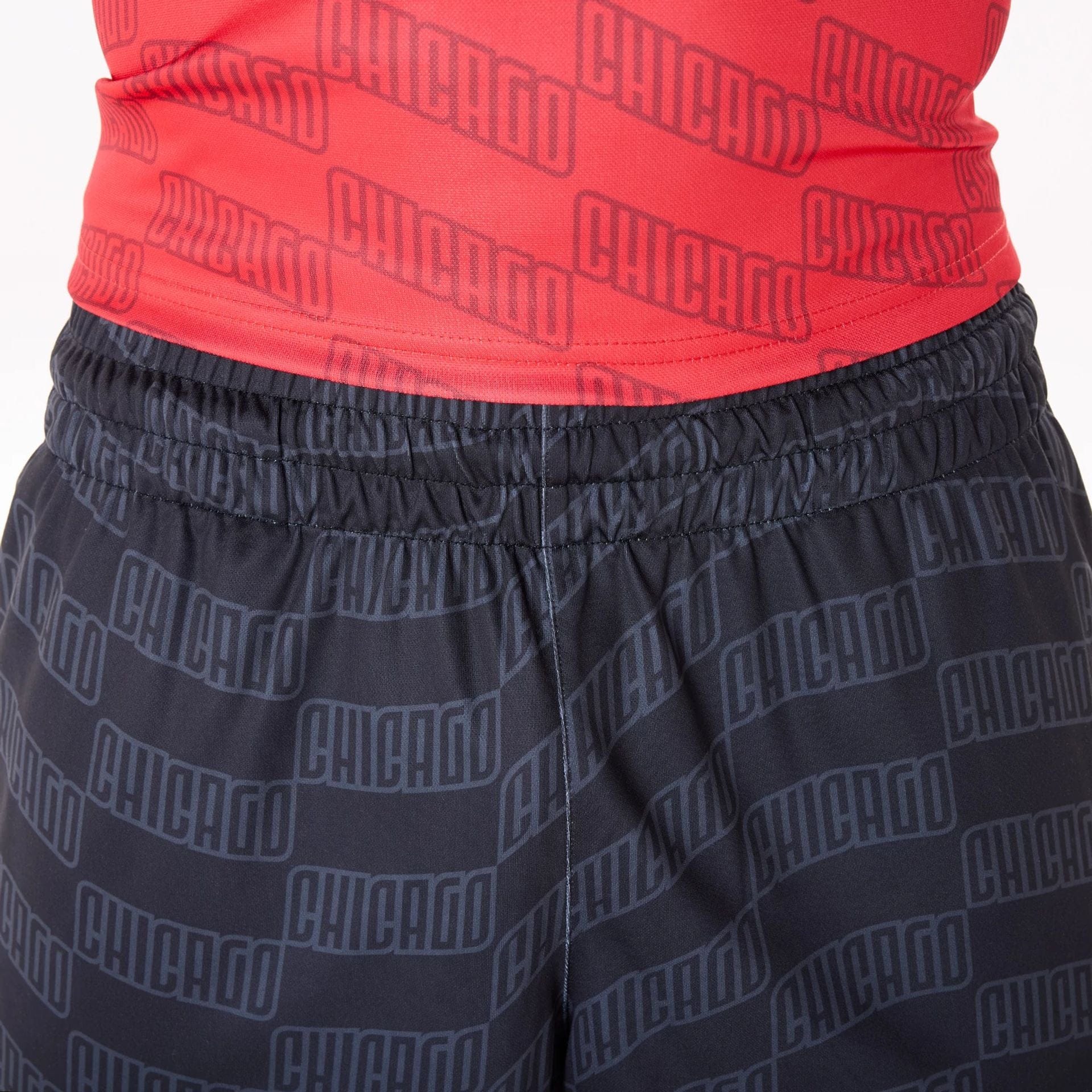 The Male model is wearing Chicago Bulls NBA All Over Print Graphic Black Shorts 4