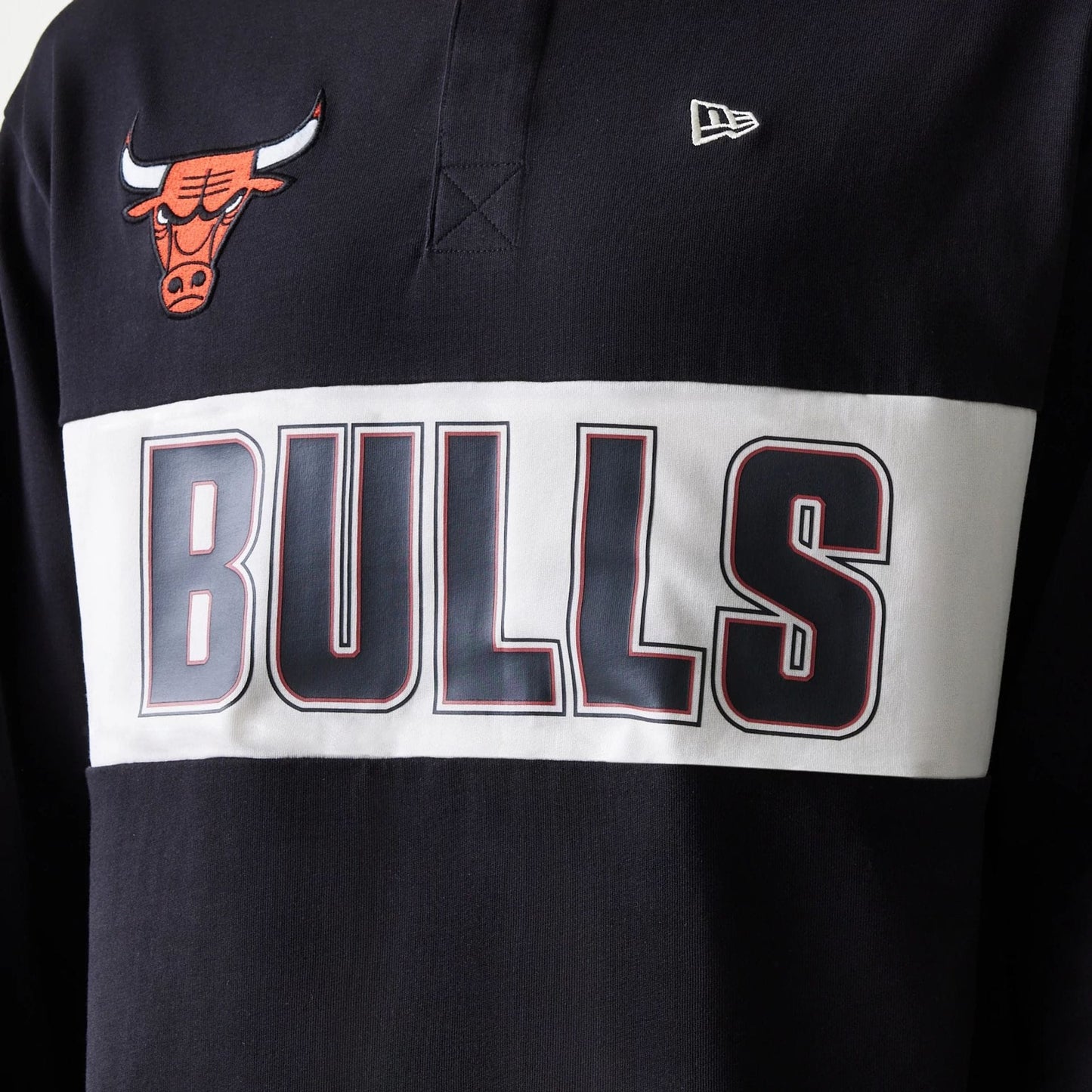 The Male model is wearing Chicago Bulls NBA Rugby Black Long Sleeve Polo 5