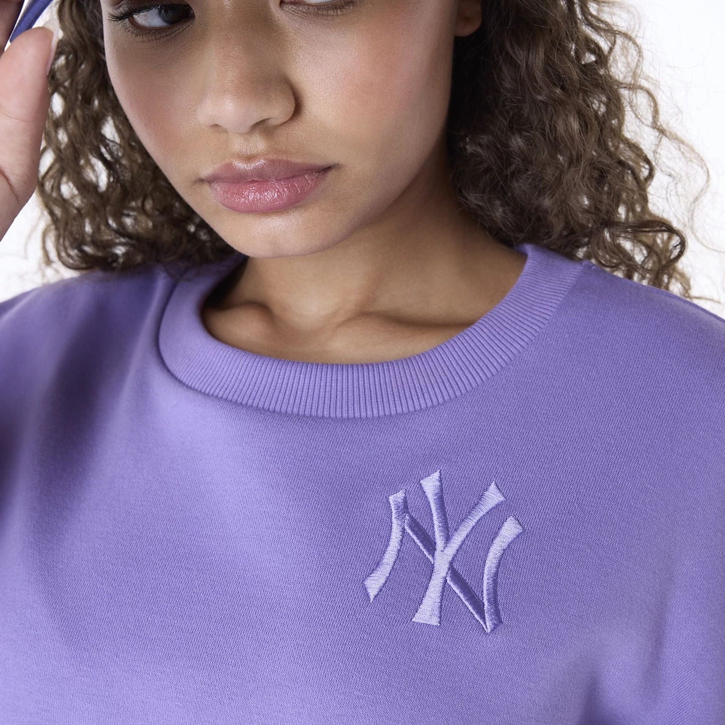 The Female model is wearing New York Yankees Womens MLB League Essential Purple Crew Neck Sweater 8