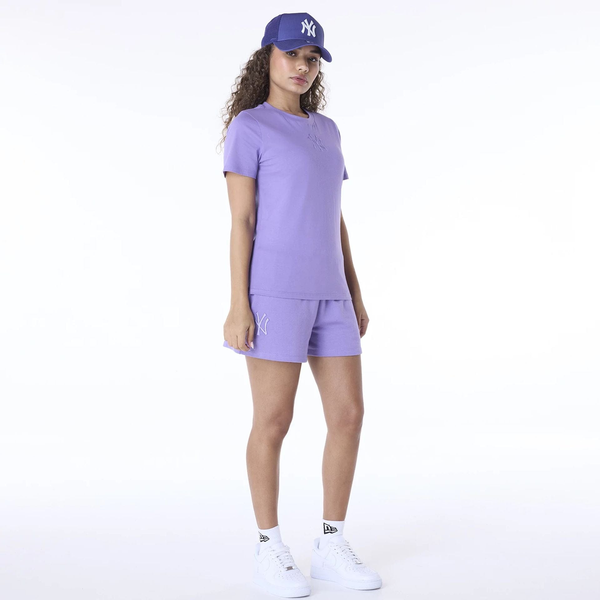 The Female model is wearing New York Yankees Womens MLB League Essential Purple Shorts 5