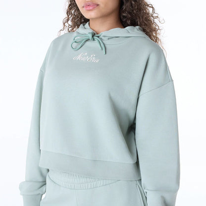 The Female model is wearing Womens New Era Script Pastel Green Pullover Hoodie 2