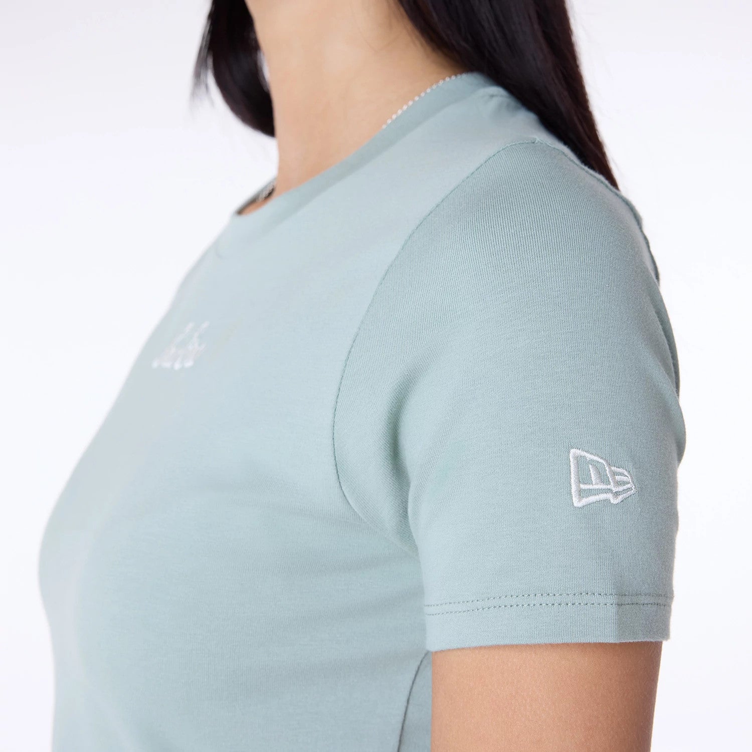 The Female model is wearing Womens New Era Slim Pastel Blue T-Shirt 4