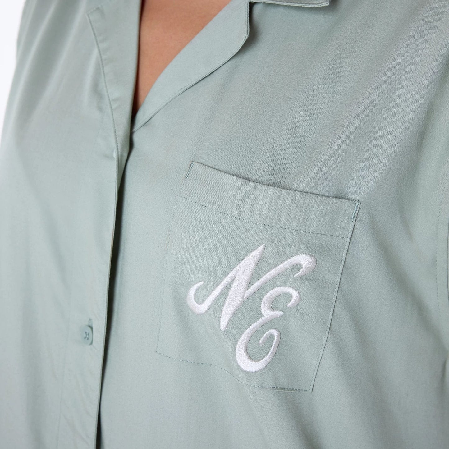 The Female model is wearing Womens New Era Revere Pastel Green T-Shirt 3