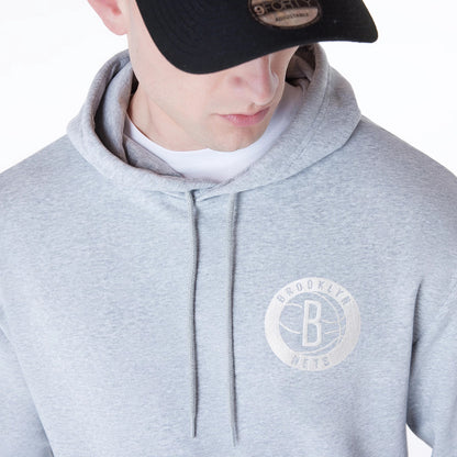 The Male model is wearing Brooklyn Nets NBA League Essential Grey Oversized Pullover Hoodie 6