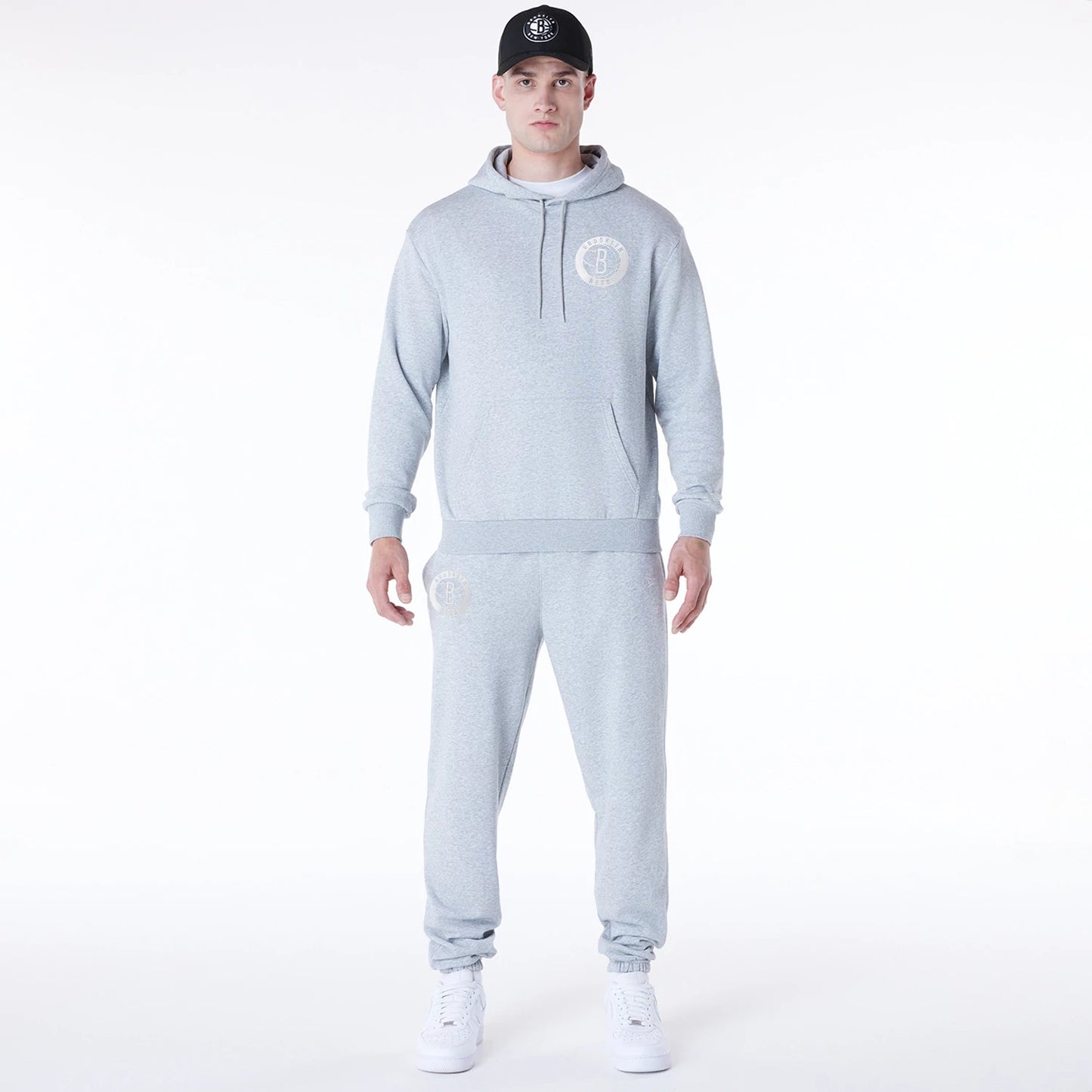 The Male model is wearing Brooklyn Nets NBA League Essential Grey Oversized Pullover Hoodie 3