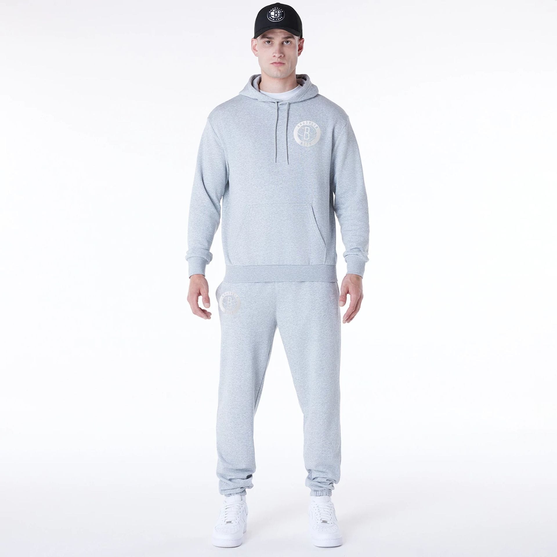 The Male model is wearing Brooklyn Nets NBA League Essential Grey Oversized Pullover Hoodie 3