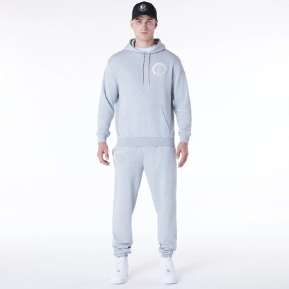 The Male model is wearing Brooklyn Nets NBA League Essential Grey Oversized Pullover Hoodie 3