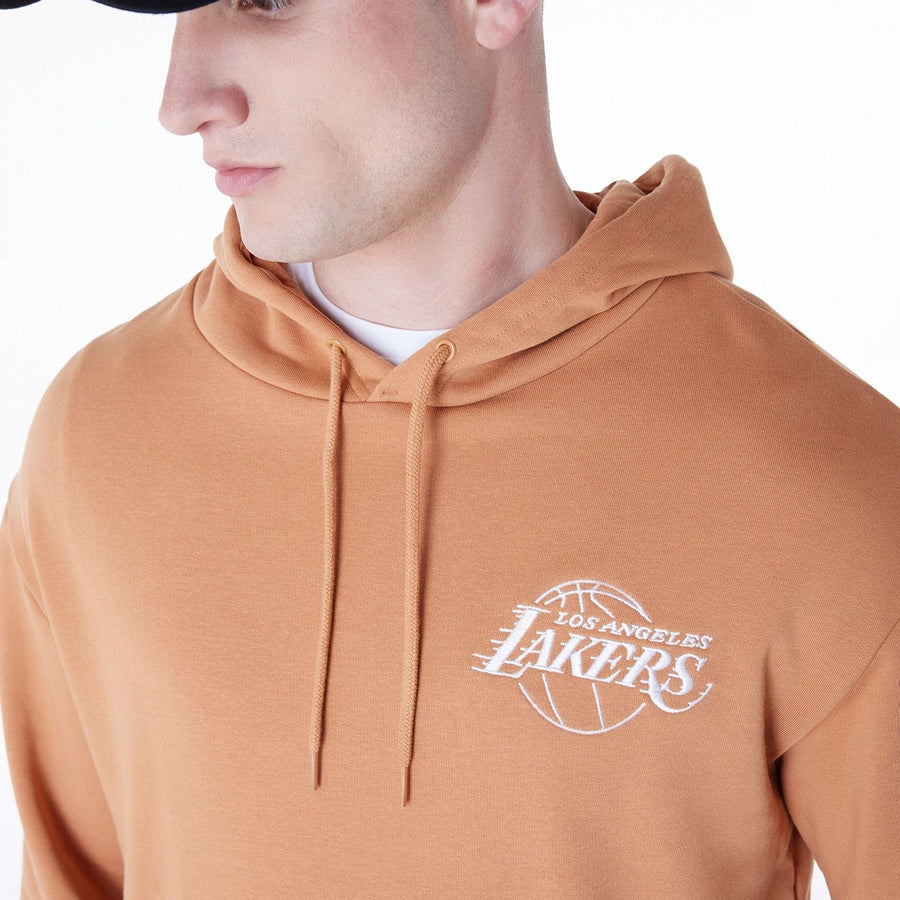 The Male model is wearing LA Lakers NBA League Essential Dark Beige Oversized Pullover Hoodie 3