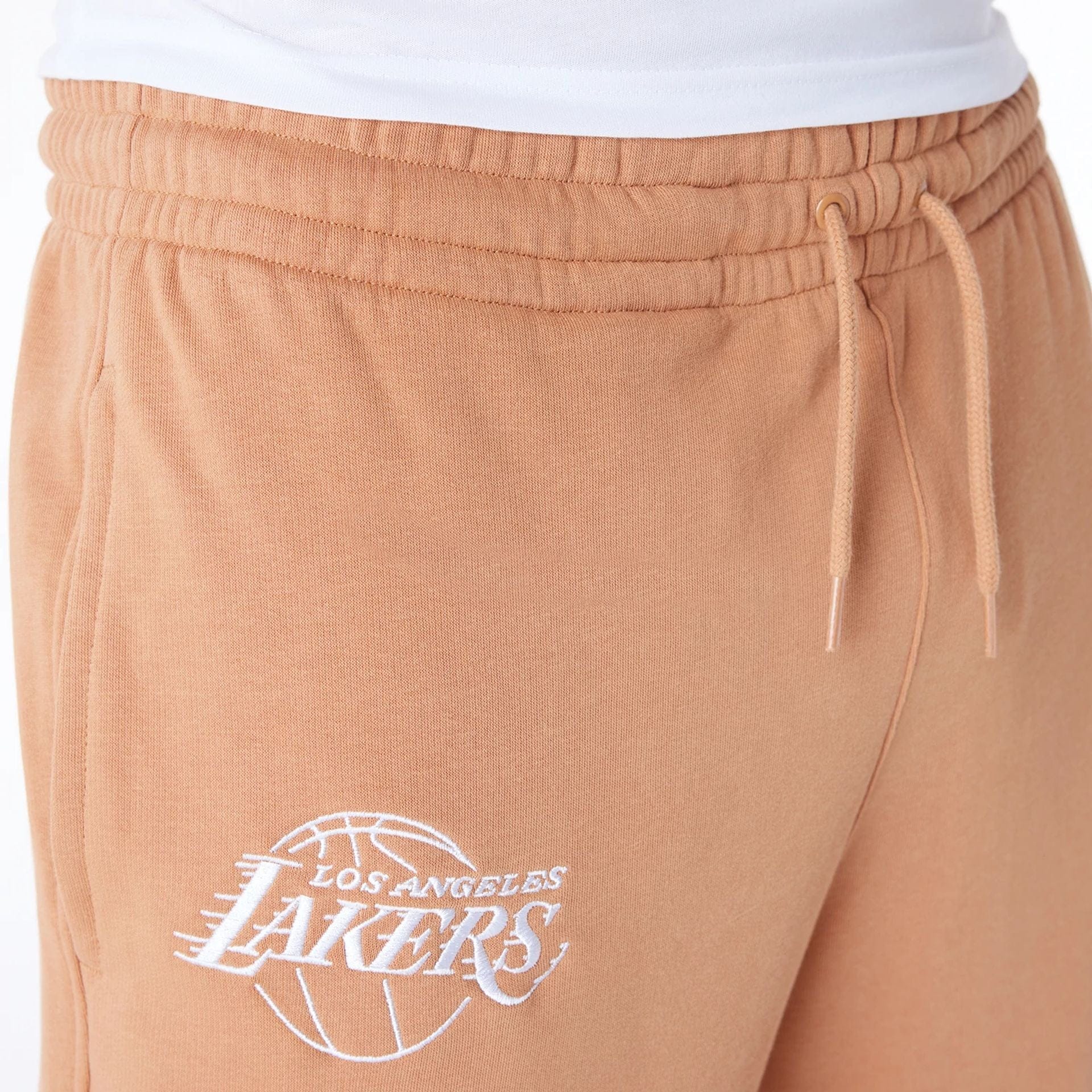The Male model is wearing LA Lakers NBA League Essential Dark Beige Fleece Joggers 7