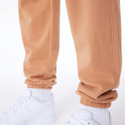 The Male model is wearing LA Lakers NBA League Essential Dark Beige Fleece Joggers 4