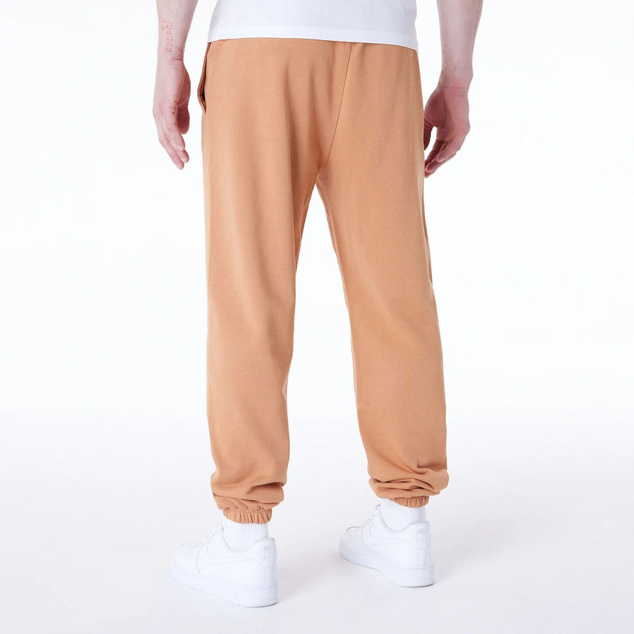 The Male model is wearing LA Lakers NBA League Essential Dark Beige Fleece Joggers 2