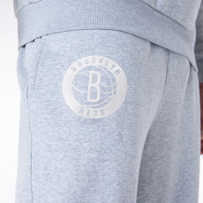 The Male model is wearing Brooklyn Nets NBA League Essential Grey Fleece Joggers 5