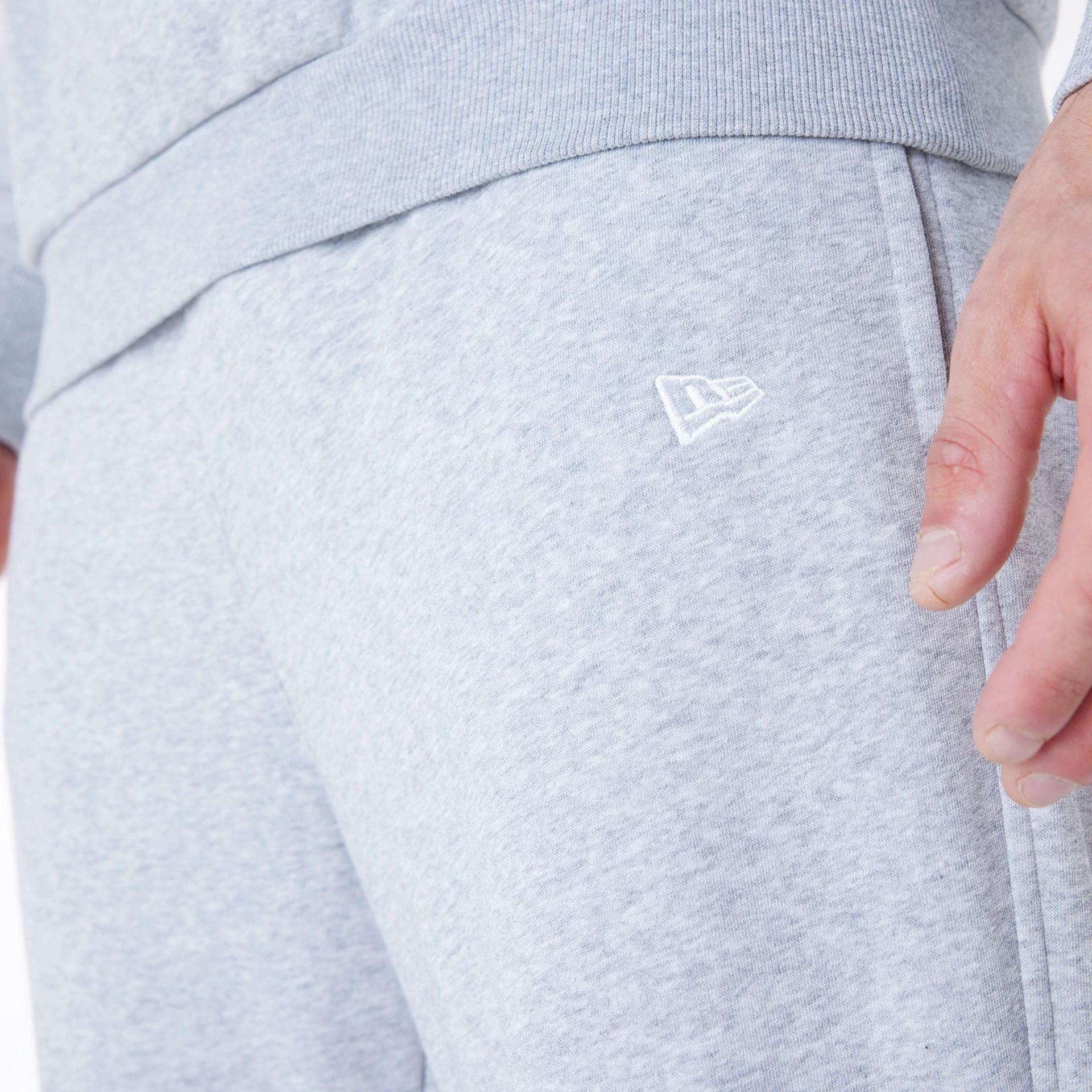 The Male model is wearing Brooklyn Nets NBA League Essential Grey Fleece Joggers 3