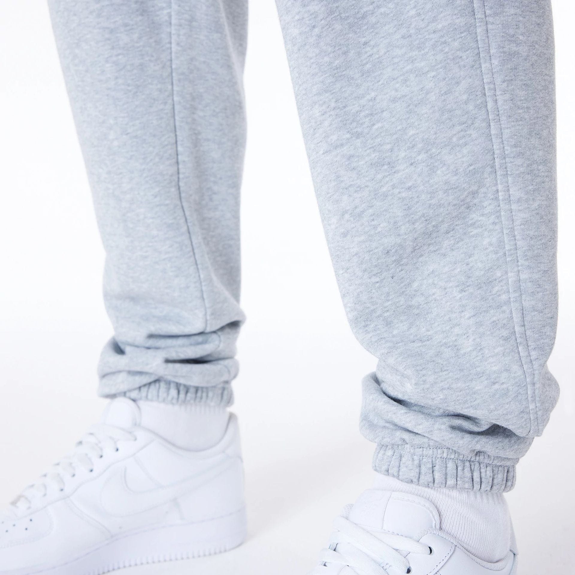The Male model is wearing Brooklyn Nets NBA League Essential Grey Fleece Joggers 6