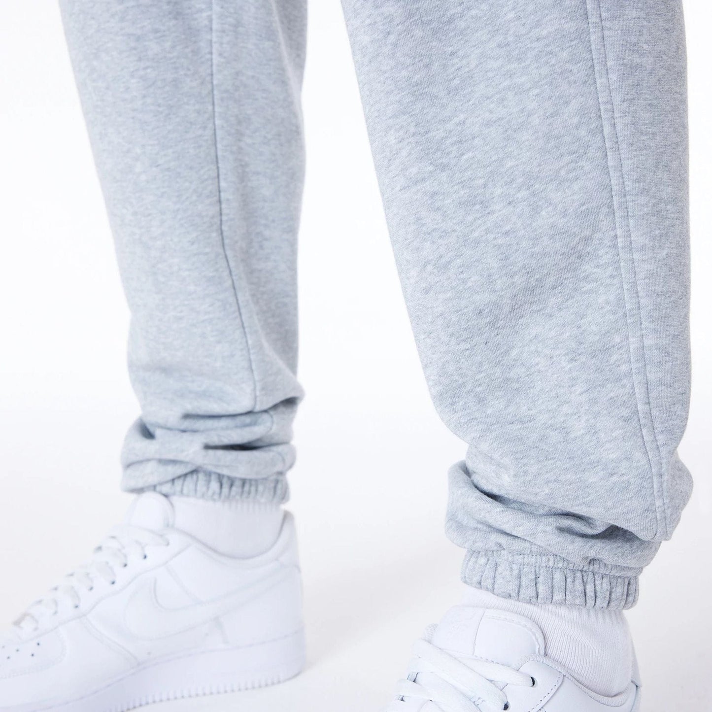The Male model is wearing Brooklyn Nets NBA League Essential Grey Fleece Joggers 6
