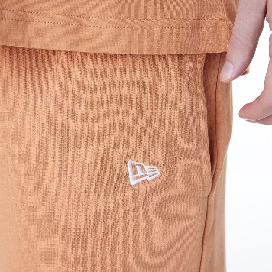 The Male model is wearing LA Lakers NBA League Essential Dark Beige Shorts 4