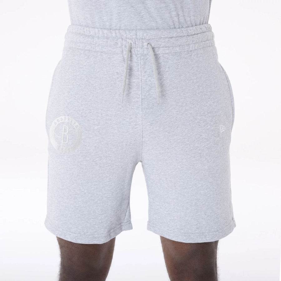 The Male model is wearing Brooklyn Nets NBA League Essential Grey Shorts 5