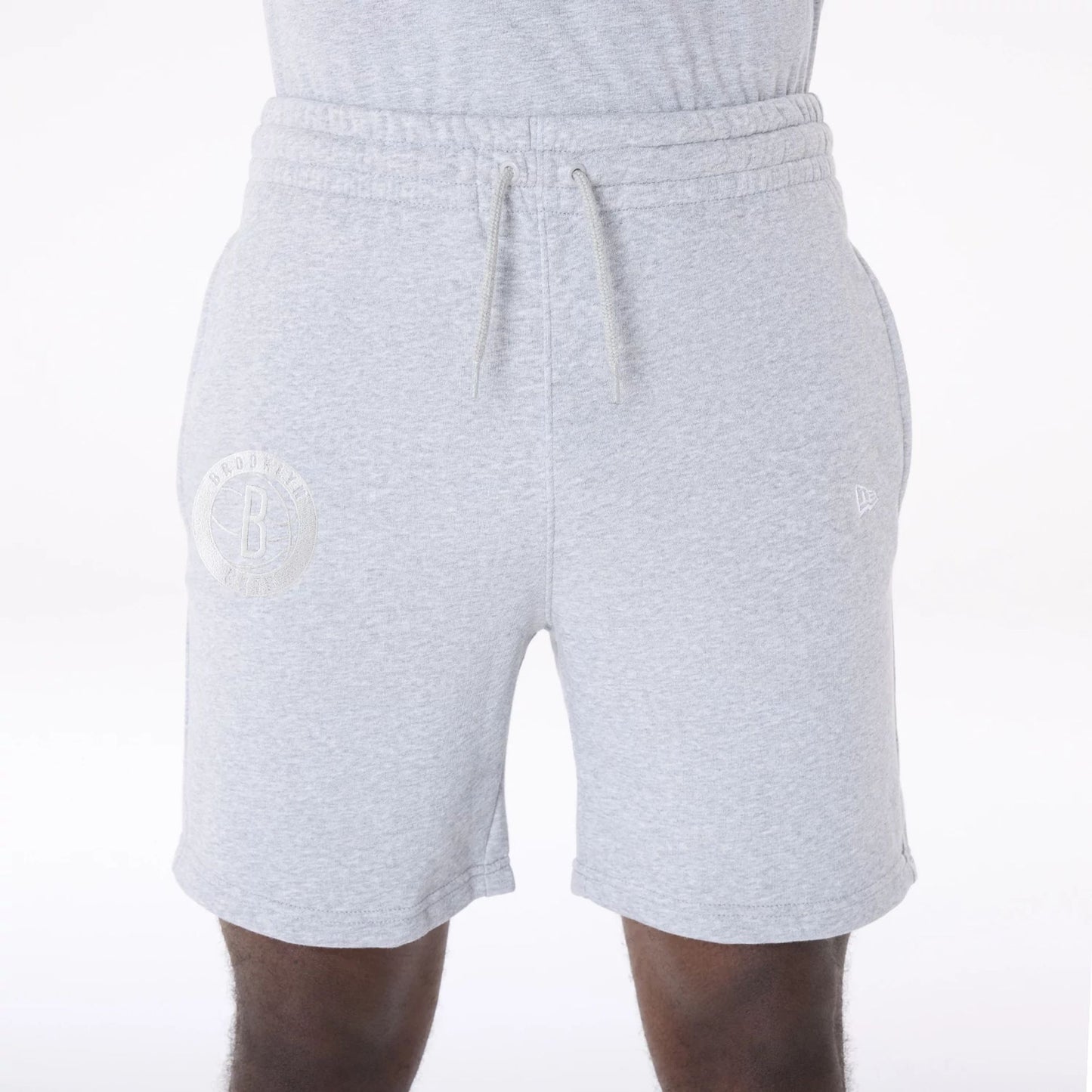 The Male model is wearing Brooklyn Nets NBA League Essential Grey Shorts 5