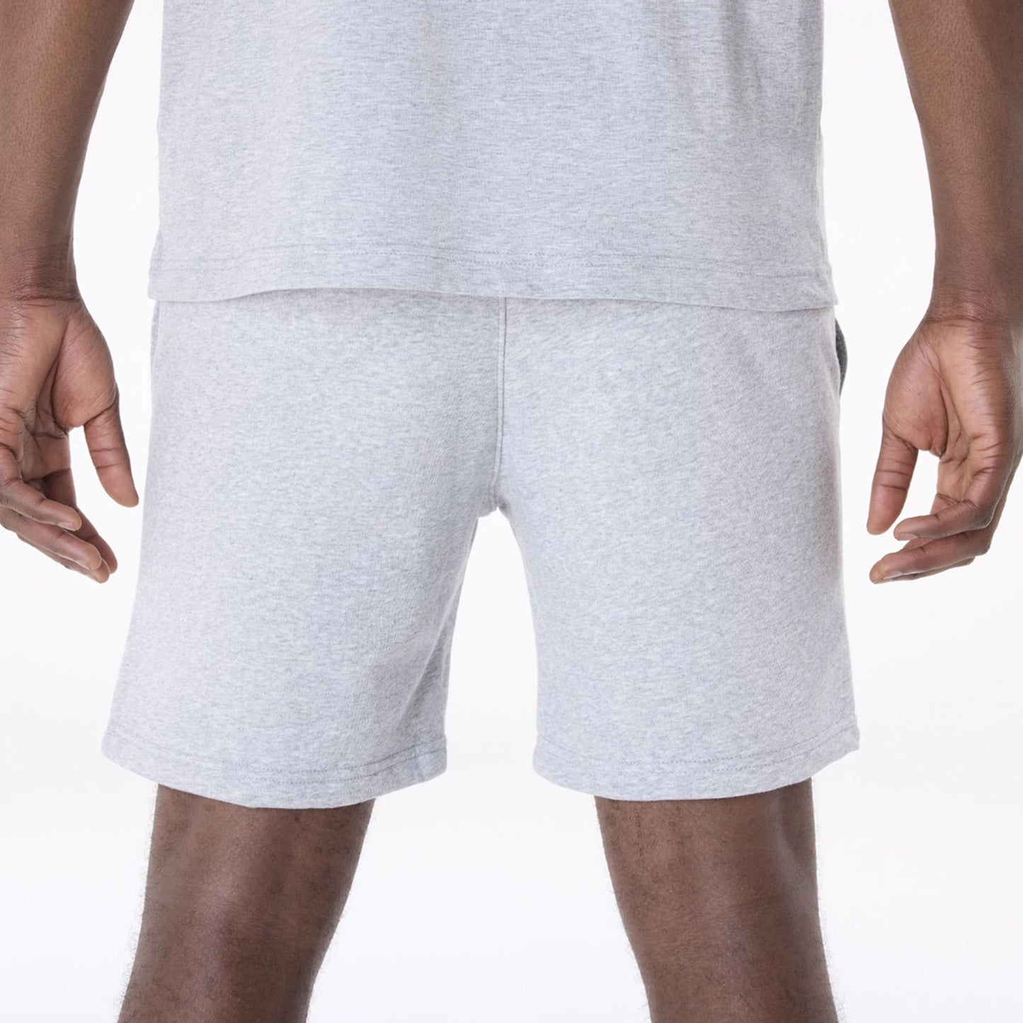 The Male model is wearing Brooklyn Nets NBA League Essential Grey Shorts 6