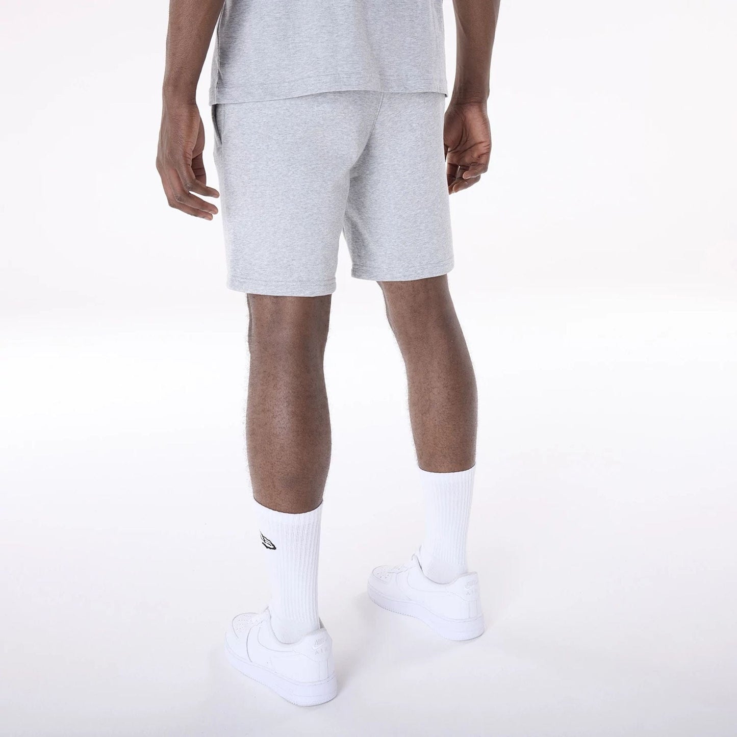 The Male model is wearing Brooklyn Nets NBA League Essential Grey Shorts 7