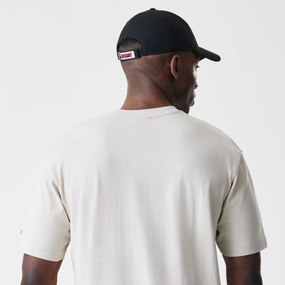 The Male model is wearing Miami Heat Modern Driver Light Beige T-Shirt 5