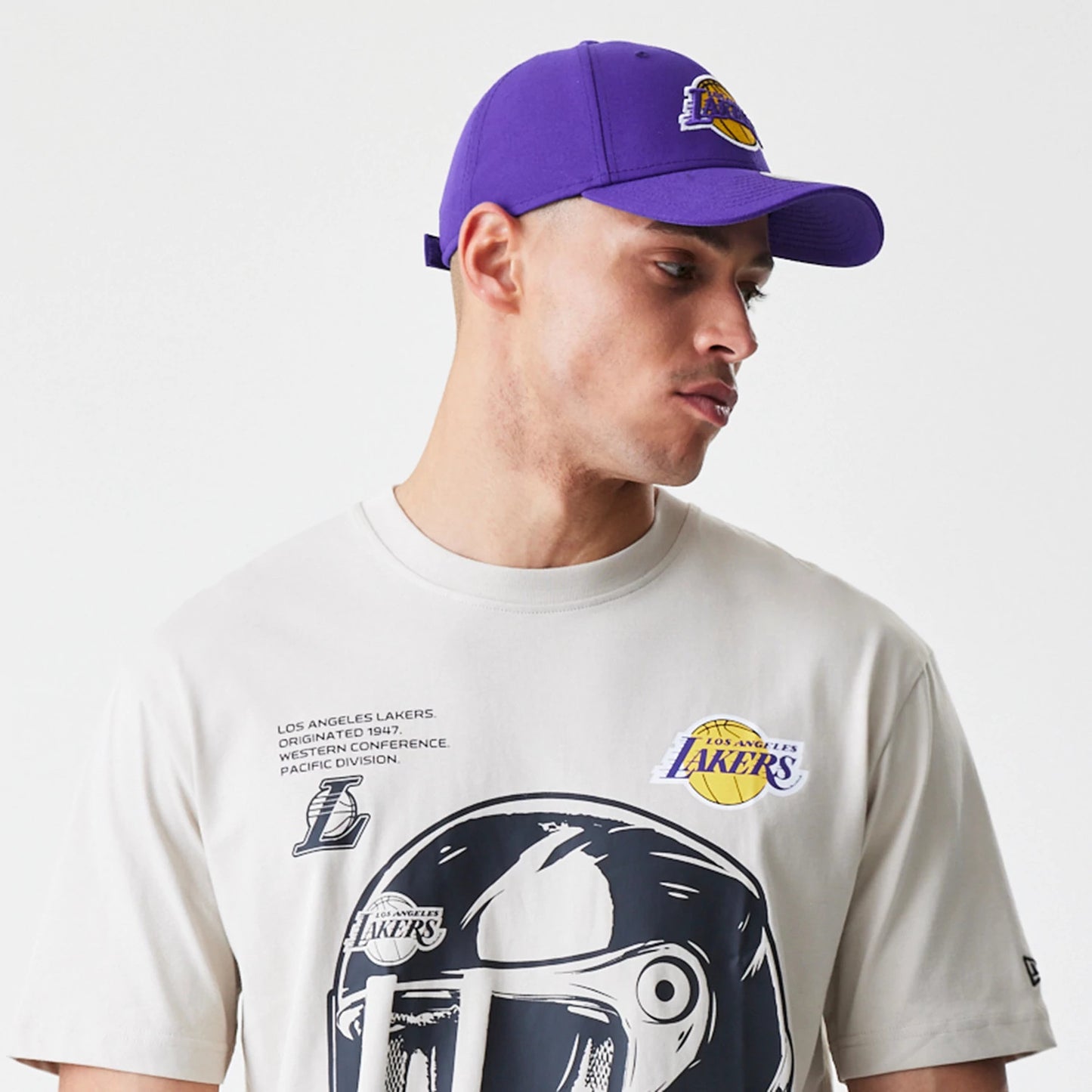 The Male model is wearing LA Lakers Modern Driver Light Beige T-Shirt 3