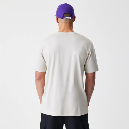 The Male model is wearing LA Lakers Modern Driver Light Beige T-Shirt 2