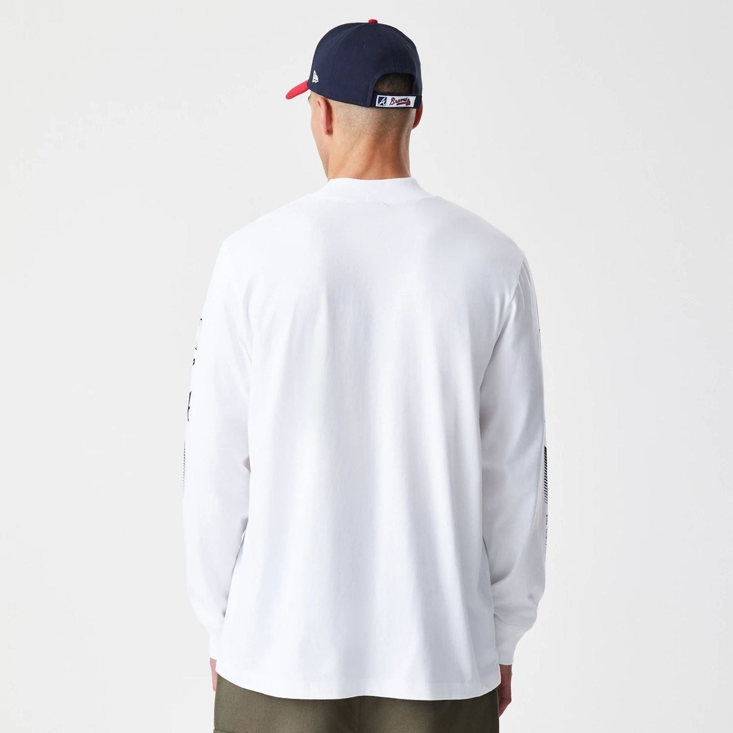 The Male model is wearing Atlanta Braves Modern Driver White Long Sleeve T-Shirt 2