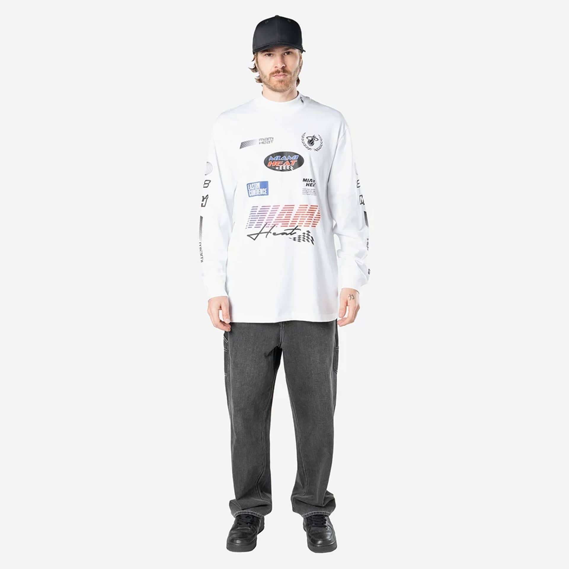 The Male model is wearing Miami Heat Modern Driver White Long Sleeve T-Shirt 5
