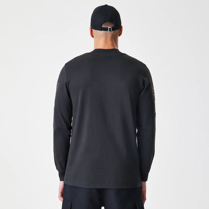 The Male model is wearing Chicago Bulls Modern Driver Black Long Sleeve T-Shirt 3