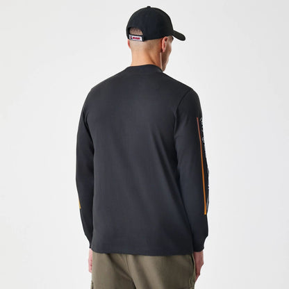 The Male model is wearing Miami Heat Modern Driver Black Long Sleeve T-Shirt 3