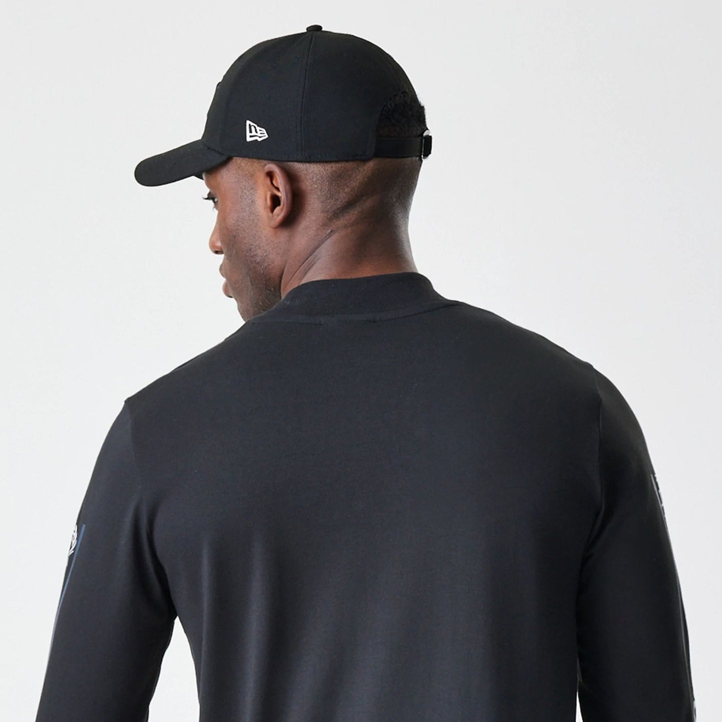 The Male model is wearing New York Yankees Modern Driver Black Long Sleeve T-Shirt 5