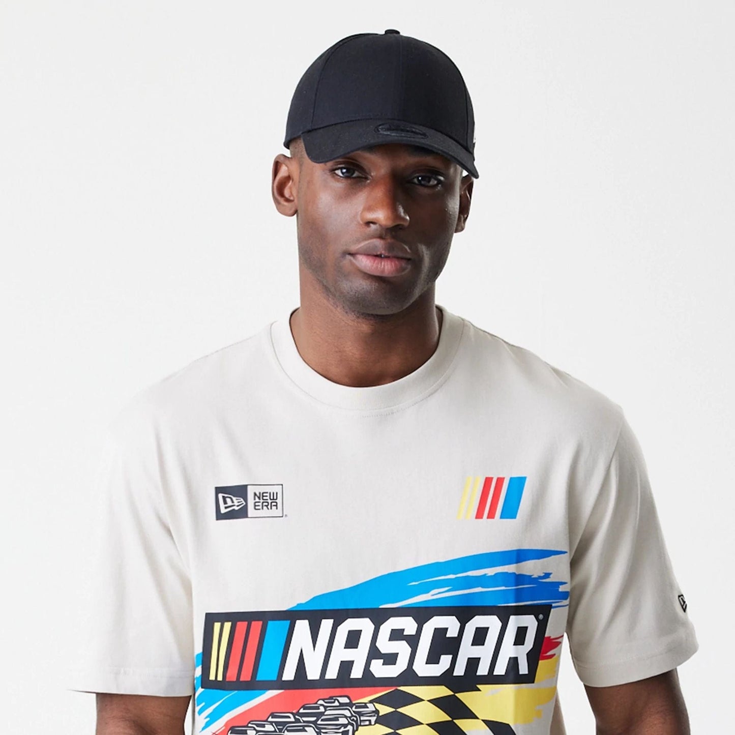 The Male model is wearing Nascar Generic Logo Modern Driver Light Beige T-Shirt 4
