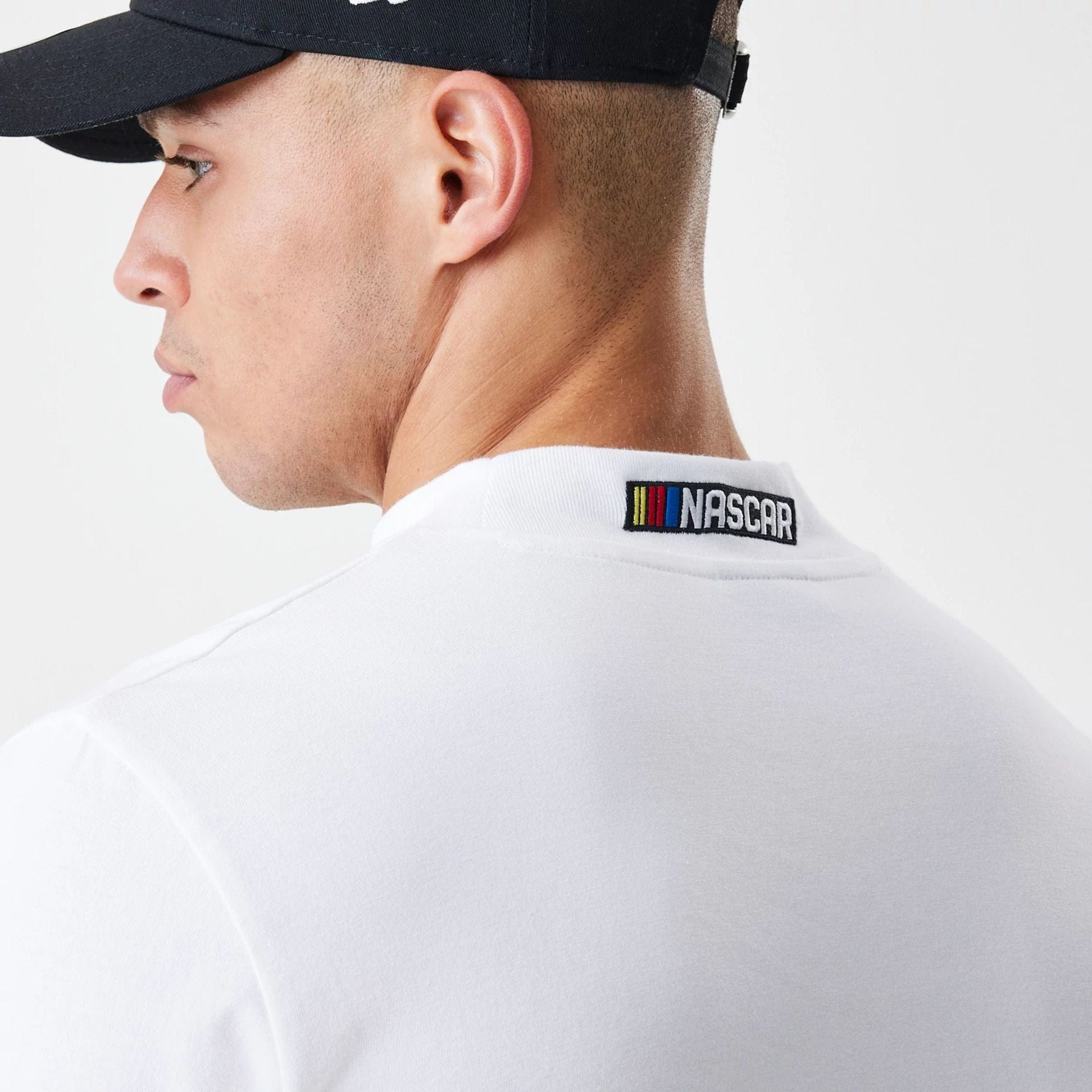 The Male model is wearing Nascar Generic Logo Modern Driver White Long Sleeve T-Shirt 4