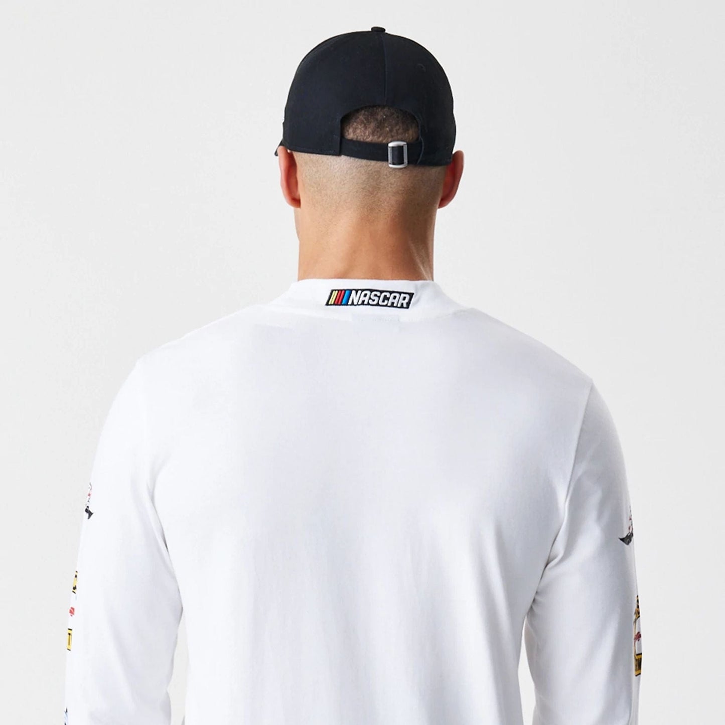 The Male model is wearing Nascar Generic Logo Modern Driver White Long Sleeve T-Shirt 5