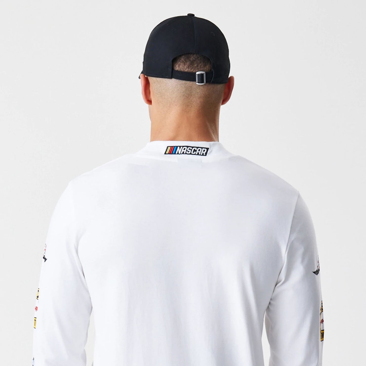 The Male model is wearing Nascar Generic Logo Modern Driver White Long Sleeve T-Shirt 5